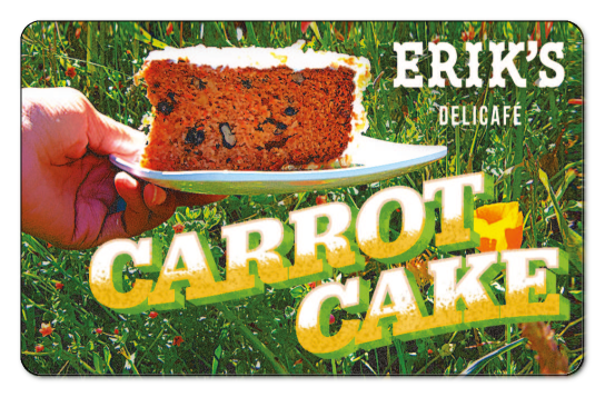 Eriks Delicafe logo and decrotive Carrot Cake text on an image of a person holding a plate of carrot cake in a field.